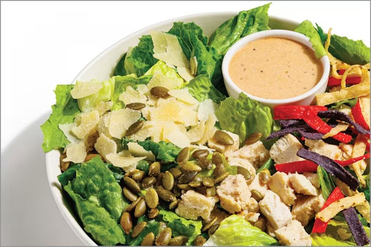 Southwest chicken caeser salad with parmesan cheese, tortilla strips and more